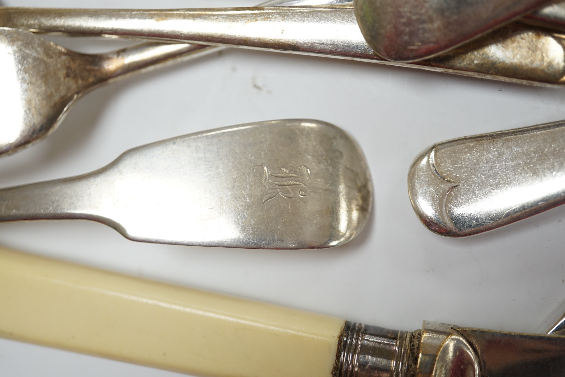 A William IV provincial silver fiddle pattern sauce ladle, John Langdon, Exeter, 1833, together with a set of six later silver coffee spoons, 4.9oz, together with a quantity of assorted plated flatware. Condition - fair